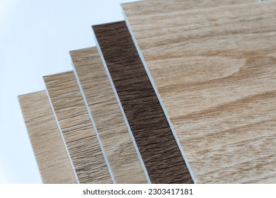 colorful wooden tiles It has a real wood texture. This is a decorative material to decorate the house with natural beauty. - Shutterstock ID 2303417181