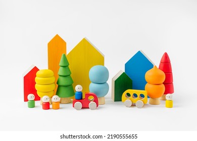 Colorful  wooden toys. Houses, trees, toy cars and little men in the colors of the rainbow. Cute kids toys to play and for decorating children's room. Wooden play set.  - Powered by Shutterstock