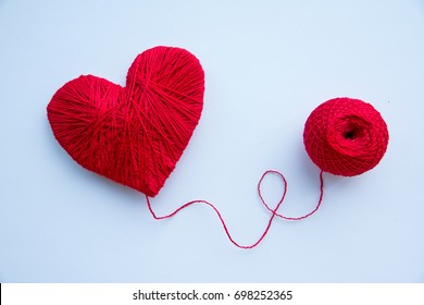 Colorful yarn ball isolated on white background. Space for text. Red heart like a symbol of love. Hobby concept - Shutterstock ID 698252365