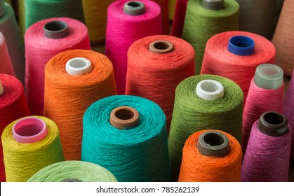 Colorful yarn on spool, yarn on tube, cotton, wool, linen thread
				