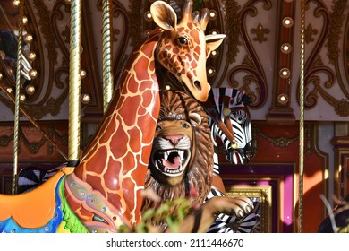 Colorful zoo animals on a carousel ride.