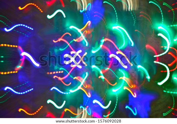 Colorfull \
geometric abstract light and science background\
Background of\
Blurry colorful of motions LED lights\
Abstract pattern of city\
lights from cars, streetlights and\
bars