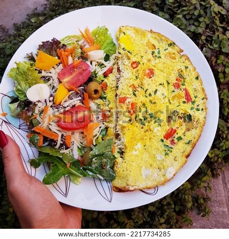 Colorfull low carbohydrate meal with omelette and fresh salad for healthy life. Paleo food. Simple lowcarb meal.