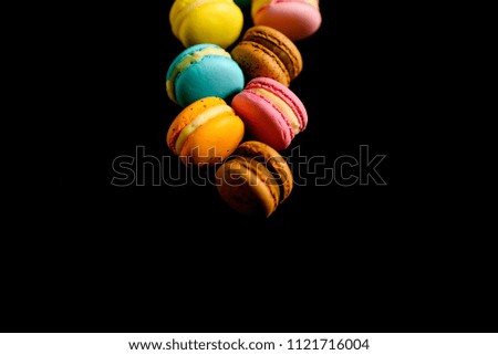 macarons lies in a row in the middle