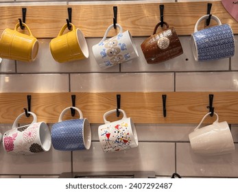 Colorfull mug hanging in wall - Powered by Shutterstock