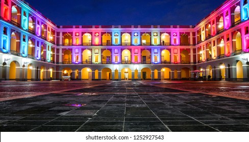 Colorfully lit museum at night in Old San Juan, Puerto Rico. 