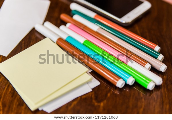 Colorfully Office and art stationery objects on
wooden table