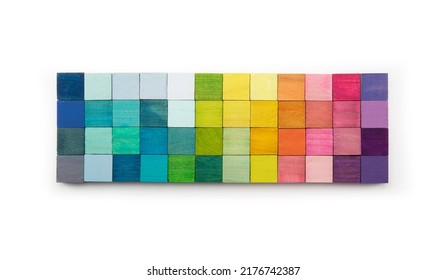 Colors of creativity. Mosaic of colored wooden blocks isolated on white, abstract. Color selection, color concept background. Arrangement or spectrum of colored wooden blocks.