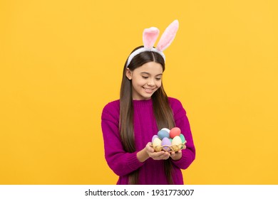 Colors Of Eater. Bunny Kid Hold Painted Eggs. Happy Easter Holiday. Funny Child In Ears. Teenager Girl Wear Rabbit Costume. Easter Bunny Egg Hunt. Just Having Fun. Ready For Party. Happy Childhood.