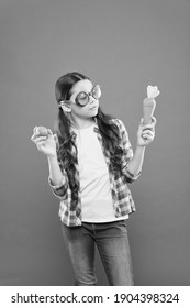 Colors Of Eater. Happy Easter. Small Girl Wearing Party Glasses. Kid On Easter Egg Hunt. Child Hold Painted Egg And Carrot. Having Fun On Spring Holiday. Schoolgirl In Summer Sunglasses. Easter Eggs.