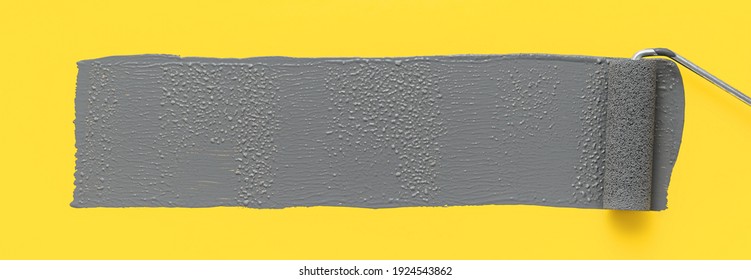 Colors of the year 2021 Ultimate Gray and Illuminating Yellow. Paint roller painting a gray stripe on a yellow background. Minimalistic banner with copy space
