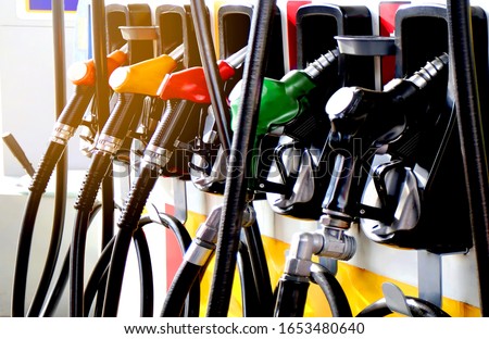 colorul fuel gasoline dispenser with sun flare background 
