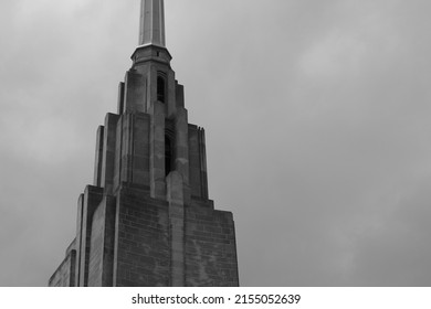 Colossal Art Deco Steeple Of An Impressive Building In Black And White.