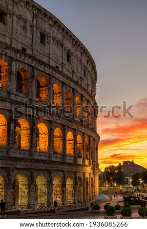 The Colosseum in city of Rome at sunset in Italy, ancient Flavian Amphitheatre and Gladiators stadium.