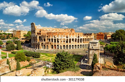 Colosseum (Coliseum), Rome, Italy, Europe. It Is Top Travel Attraction Of Rome. Skyline Of Rome, Panoramic Scenic View Of Colosseum And Sky. Panorama Of Ancient Roman Ruins, Landscape Of Old Rome City