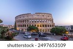 Colosseum day to night after sunset, Rome. Evening illumination. Traffic on the road. Rome best known architecture and landmark. Rome Colosseum is one of the main attractions of Rome and Italy