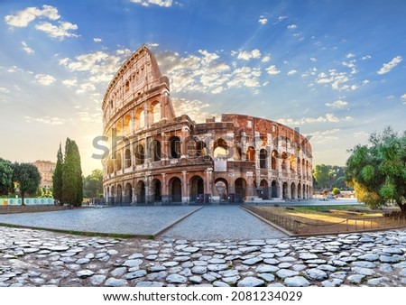 The Colosseum in the morning sun rays, beautiful view of Rome, Italy