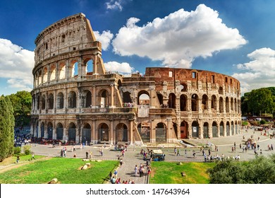 Colosseum in Rome, Italy. Ancient Roman Colosseum is one of main tourist attractions in Europe. People visit famous Colosseum in Roma city center. Scenic nice view of Colosseum ruins in summer.