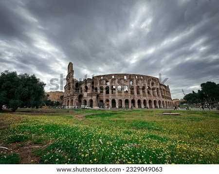 The Colosseum in Rome, Italy on a cloudy day.