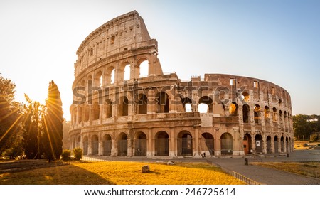 Colosseum at sunrise in Rome, Italy, Europe. Rome ancient arena of gladiator fights. Rome Colosseum is the best known landmark of Rome and Italy