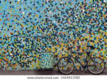 Colour your world and ride a bike. Blue bicycle in front of  colourful wall, streets of Düsseldorf, North Rhine-Westphalia, Germany, 