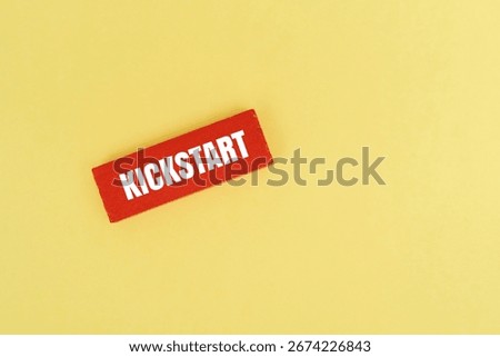 A coloured block with text KICKSTART