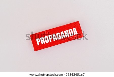 A coloured block with text PROPAGANDA