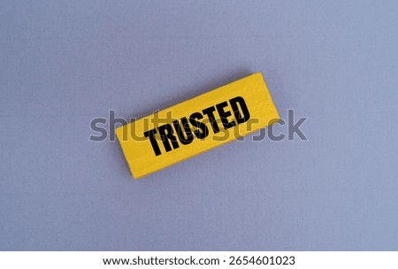 A coloured block with text TRUSTED. Reliability and trustworthiness