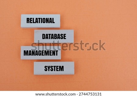 A coloured blocks with text RELATIONAL DATABASE MANAGEMENT SYSTEM. A concept for structured data storage, software engineering and organized IT infrastructure