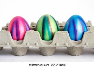 Coloured eggs, Easter eggs, in an egg carton