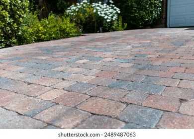 Coloured interlocking block paved driveway at an attractive suburban property