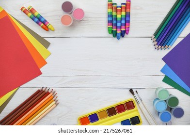 coloured pencils, coloured paper and wood surface drawing accessories, layouts - Powered by Shutterstock