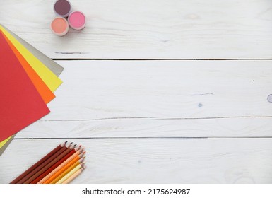 coloured pencils, coloured paper and wood surface drawing accessories, layouts - Powered by Shutterstock