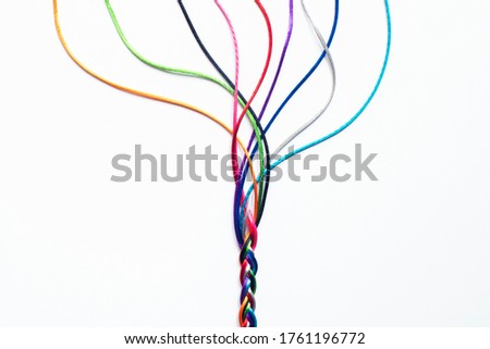 Coloured String Woven Together To Illustrate Concepts Of Unity Society Togetherness and Cooperation