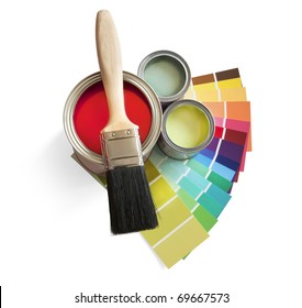coloured swatches and paint pot and paintbrush on white background