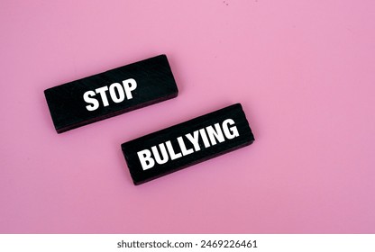 A coloured wooden block with word “STOP BULLYING” on it - Powered by Shutterstock