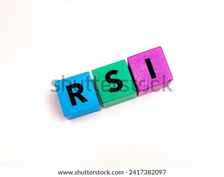 A coloured wooden block with word “RSI” on it. RSI stands for 