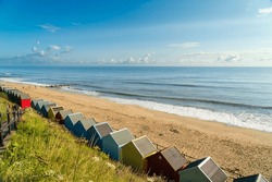 Colourful Beach Huts On The Beach In Mundesley, North Norfolk, UK On A Summer Morning
