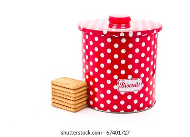 Colourful Biscuit Tin With Biscuits Next To It