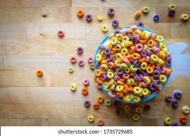 Colourful Bowl Of Breakfast Cereal On Wooden Table Top, Flat Lay.