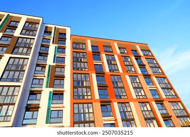 Colourful Building exterior. New house, home complex. Colored Facade building background. Modern building, houses with glass windows. New Buildings architecture. Residential apartment. Condominium. - Powered by Shutterstock