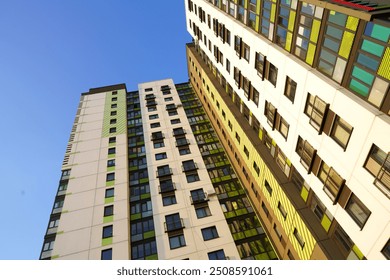 Colourful Building exterior. New house, home complex. Colored Facade building background. Modern building, houses with glass windows. New Buildings architecture. Residential apartment. Condominium. - Powered by Shutterstock