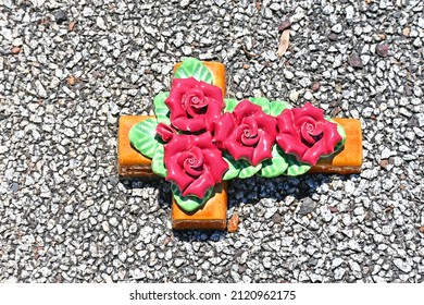 Colourful Ceramic Flowers On A Grave Site