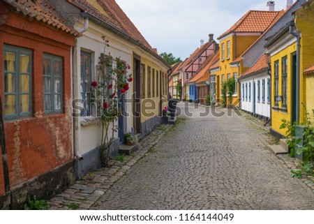 Colourful cobblestone streets of the main city of the island Aero in Aeroskobing, Denmark. Romantic fairytale, wedding and tourist destination. Travel concept.
