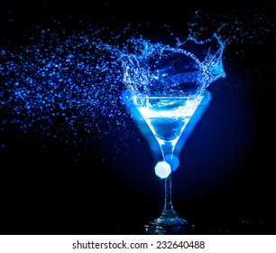 colourful cocktail on the black background. Party club entertainment. Mixed light