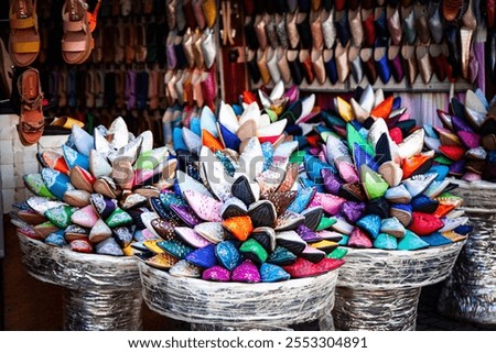 Colourful displays of babouche slippers in Marrakech market souk