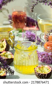 Colourful Drinks And Lilac Flowers And Passion Fruit And A Drink Splash In A Light Sunny Background 