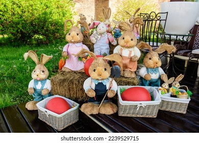 Colourful Easter decorations and bunnies displayed near an outdoor terace