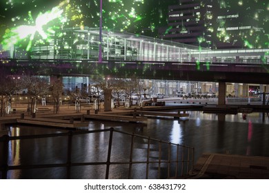 Colourful fireworks exploding on black background against illuminated modern building