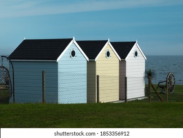 Colourful Garden Sheds In A Seaside Garden